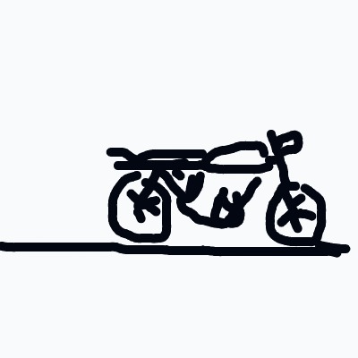 A motorcycle with a rider is on a road.