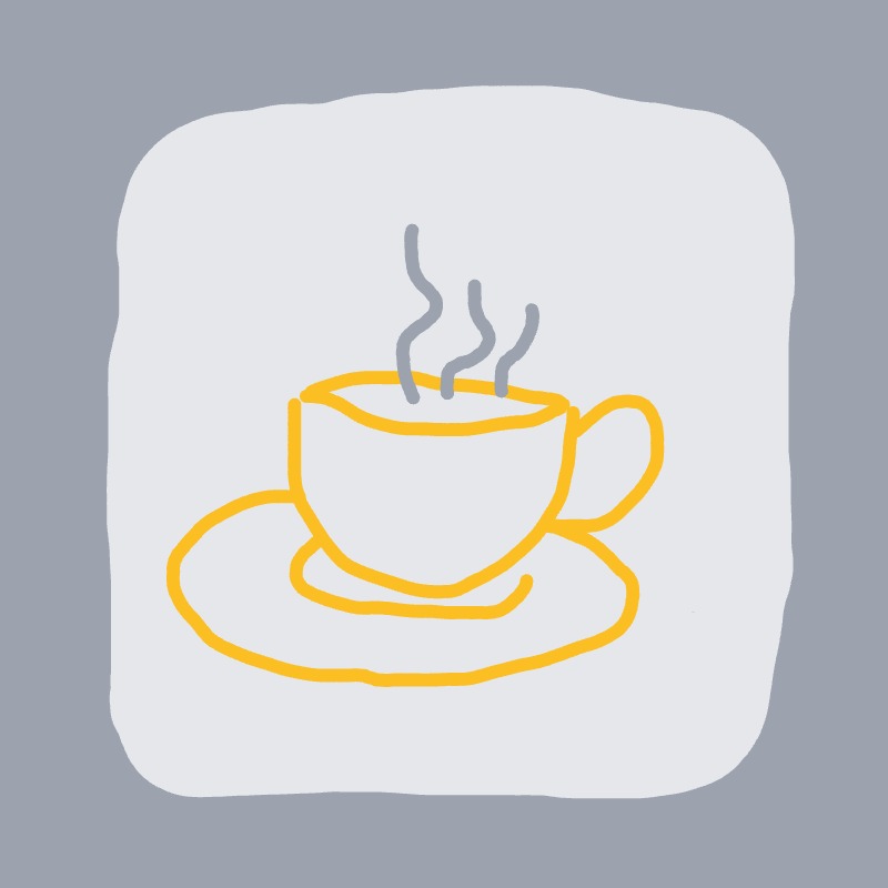 A steaming cup sits on a saucer.